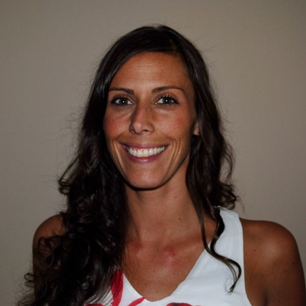 A photo of Kayla smiling brightly at the camera
